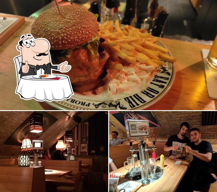 Take a look at the picture depicting dining table and burger at The Pub