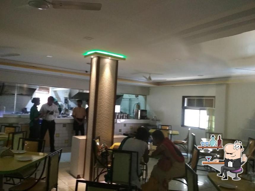 Take a seat at one of the tables at Gayatri Veg Culture