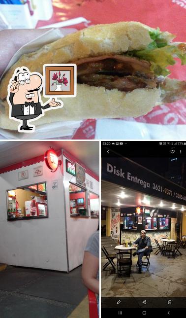 A foto da interior e cidadãos no Giovana's Lanches Burguer