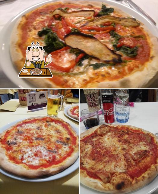 Prenditi una pizza a Pizzeria Ristorante al Caminetto