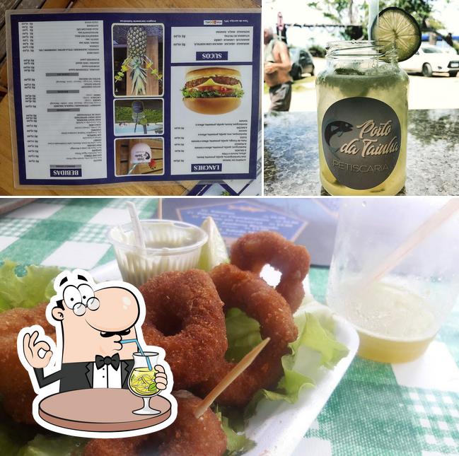 The photo of drink and burger at Petiscaria Porto da Tainha