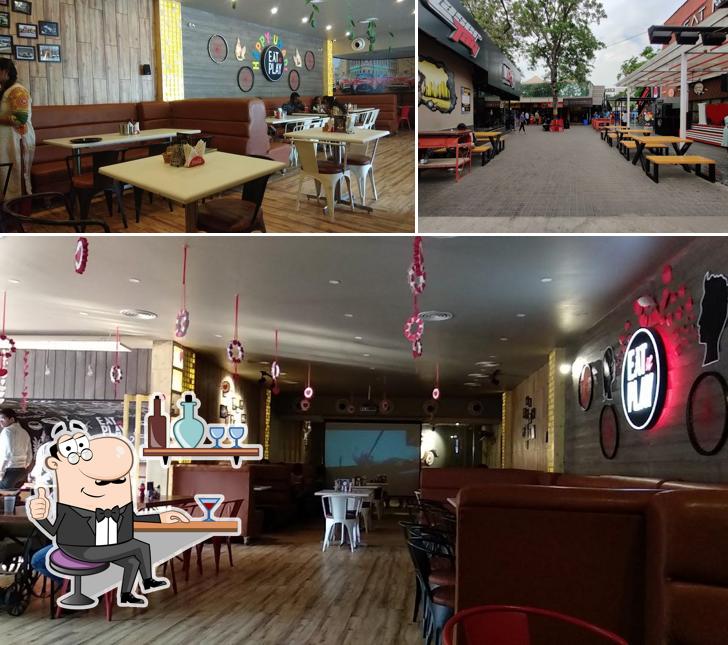 Take a seat at one of the tables at EATNPLAY