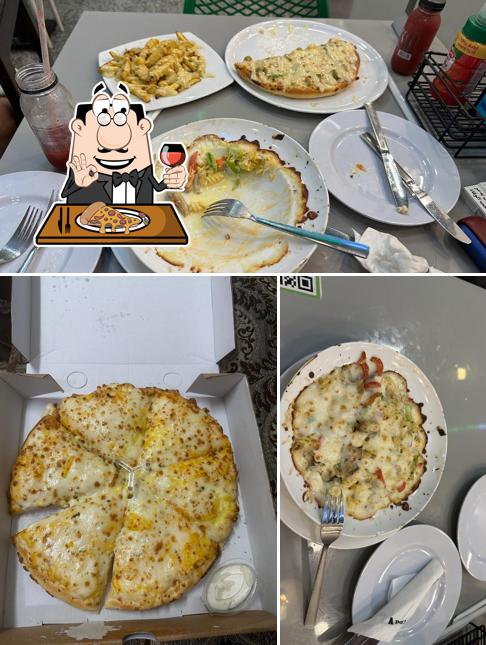 Essayez des pizzas à Pizza company zayed