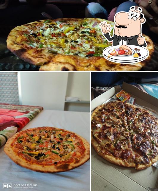 Get pizza at Varah Square Guest House
