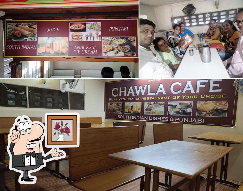 Take a seat at one of the tables at Chawla Cafe