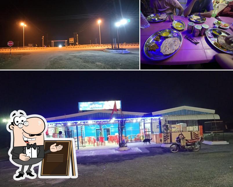 The photo of exterior and dining table at Mahakal highway kitchen