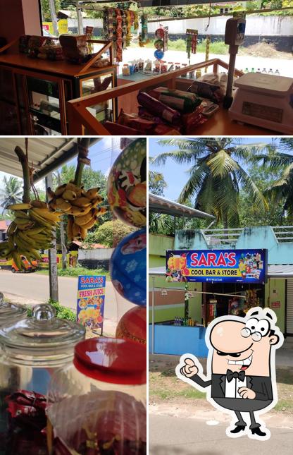 This is the image depicting exterior and play area at Sara's cool bar & store