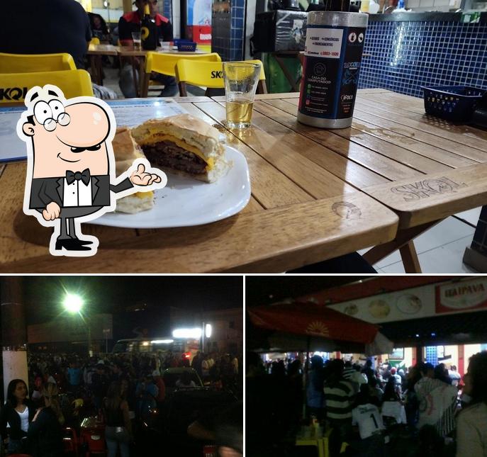 Sente em uma das mesas no Âncora's Lanchonete, Bar e Restaurante
