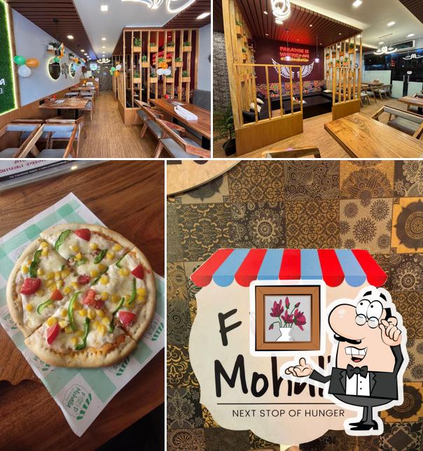 Take a look at the photo showing interior and food at Food Mohalla Jhunjhunu