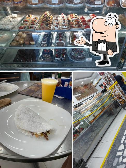 Sente em uma das mesas no Juca Panificadora e Restaurante