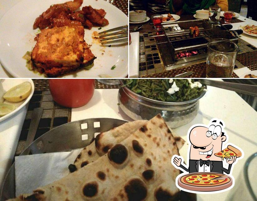 Try out pizza at Archi Saffron Restaurant( North Indian cuisine)