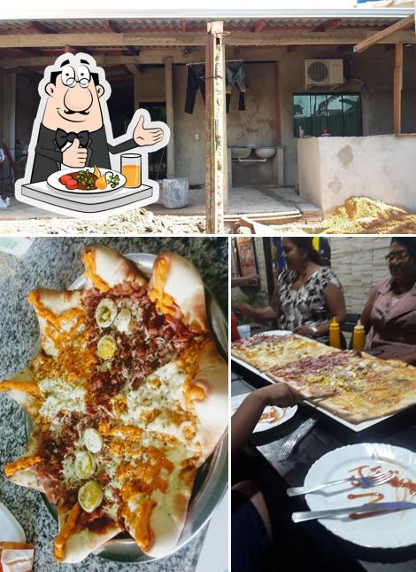 A foto a MV Pizzaria’s comida e exterior