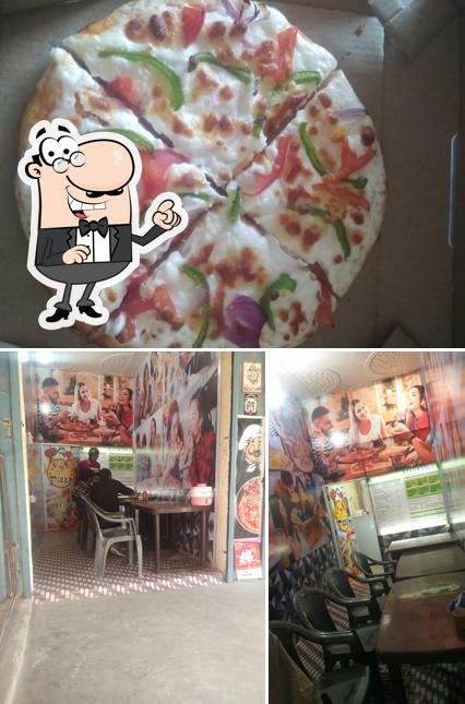 The image of interior and pizza at Manshi pizza