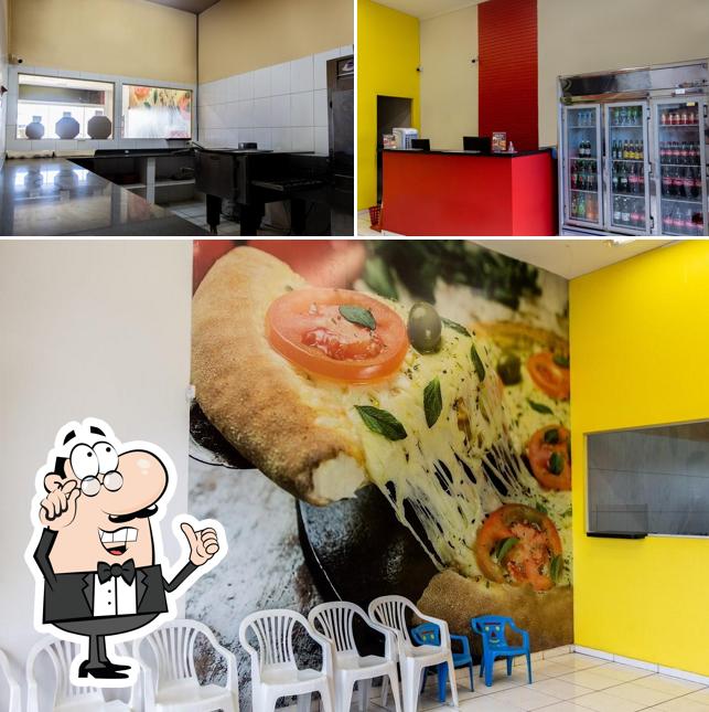 O interior do Pizza Club Saul