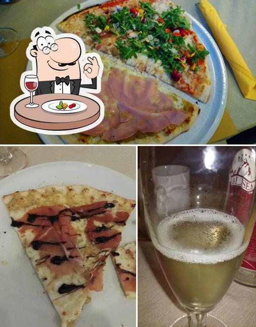 Tra le varie cose da Pizzeria agli Amici si possono trovare la cibo e birra