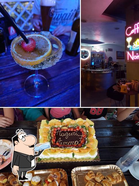 Take a look at the picture depicting drink and cake at Bar Caffè Noir 97h