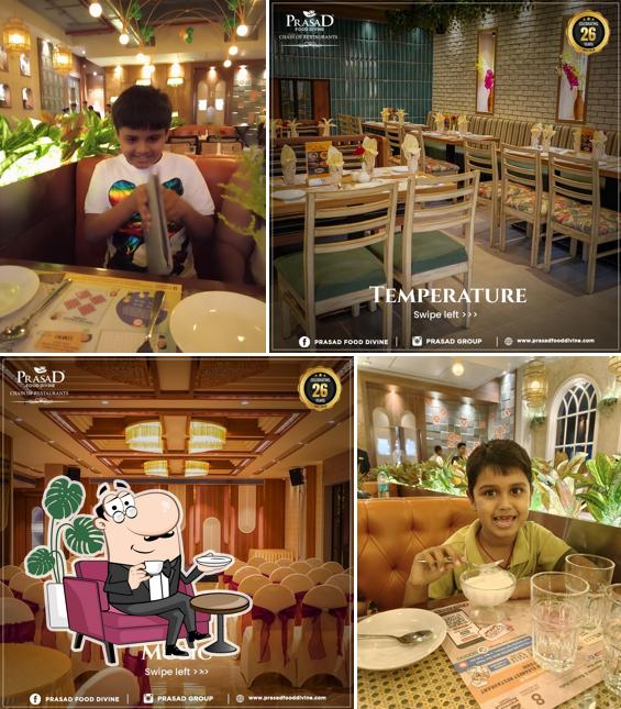Take a seat at one of the tables at Prasad Food Divine
