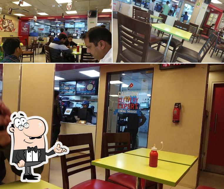 Take a seat at one of the tables at Domino's Pizza Niranjanpur, Dehradun