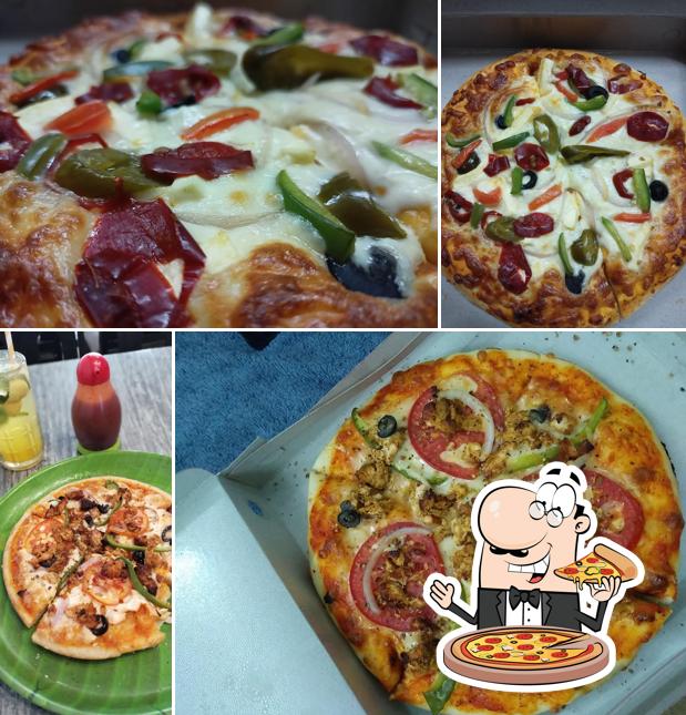 Get pizza at Happy Juice & Snacks