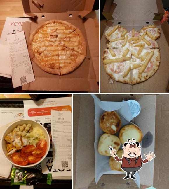 Снимок, на котором видны еда и внутреннее оформление в Додо Пицца
