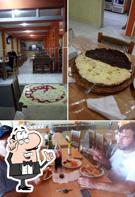 O interior do Pizzaria Super Pizza