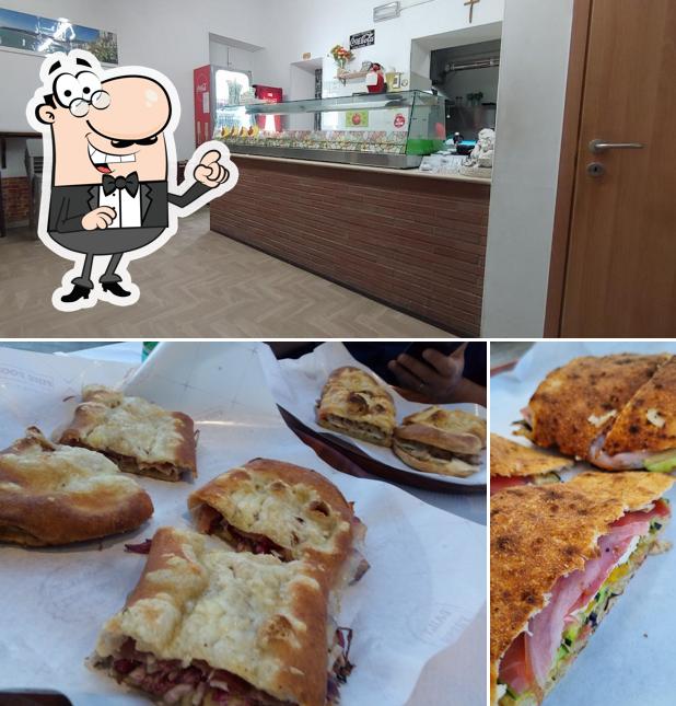 Dai un'occhiata agli interni di Pizzeria Da Enzo con Forno a Legna