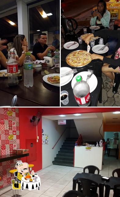 Esta é a foto apresentando comida e interior a Reis da Pizza