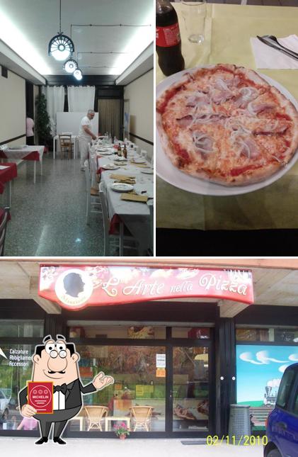 Guarda la immagine di pizzeria l'arte nella pizza