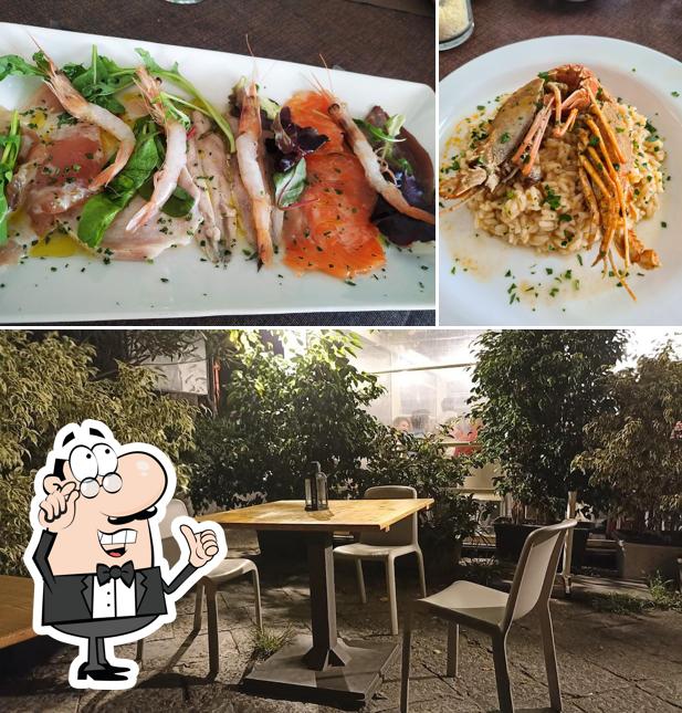Siediti a un tavolo di Ristorante Pizzeria Café Du Port