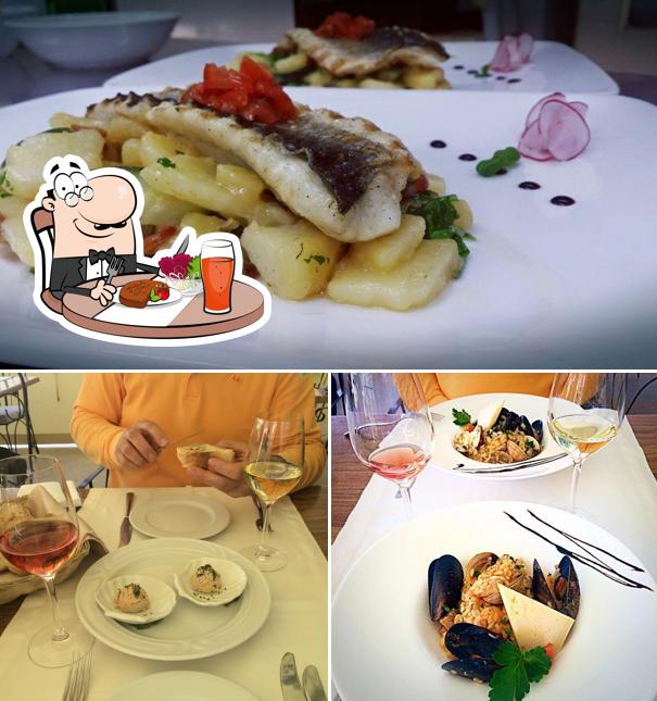 Questa è la foto che mostra la tavolo da pranzo e cibo di Restaurant Kamenar