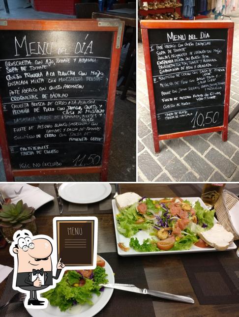 Check out the image displaying blackboard and food at Pizzeria Daccapo