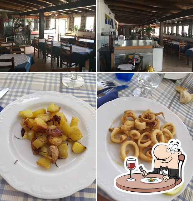 Посмотрите на это фото, где видны еда и внутреннее оформление в Albergo Ristorante Miramare Di Lotti Santina