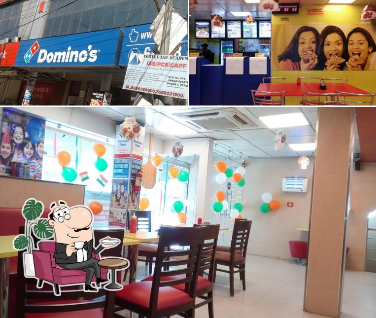 The image of interior and exterior at Domino's Pizza