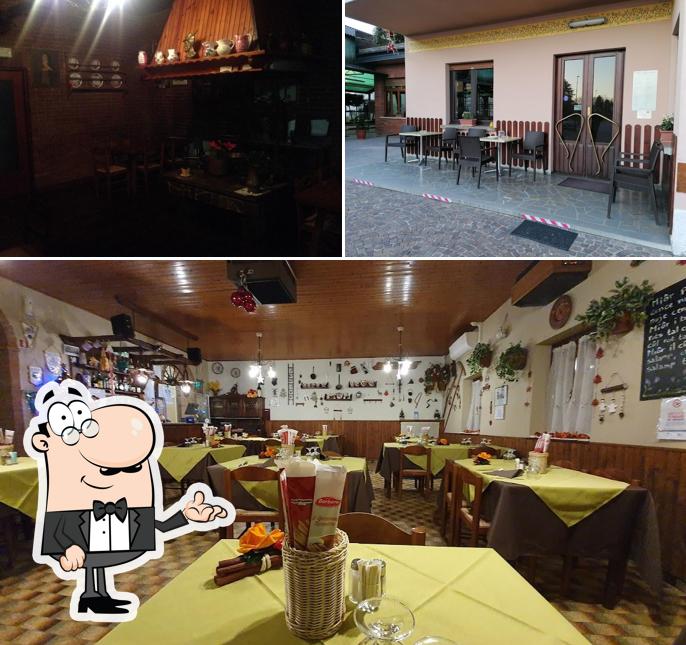 La immagine della interni e bancone da bar di Trattoria ai Cacciatori