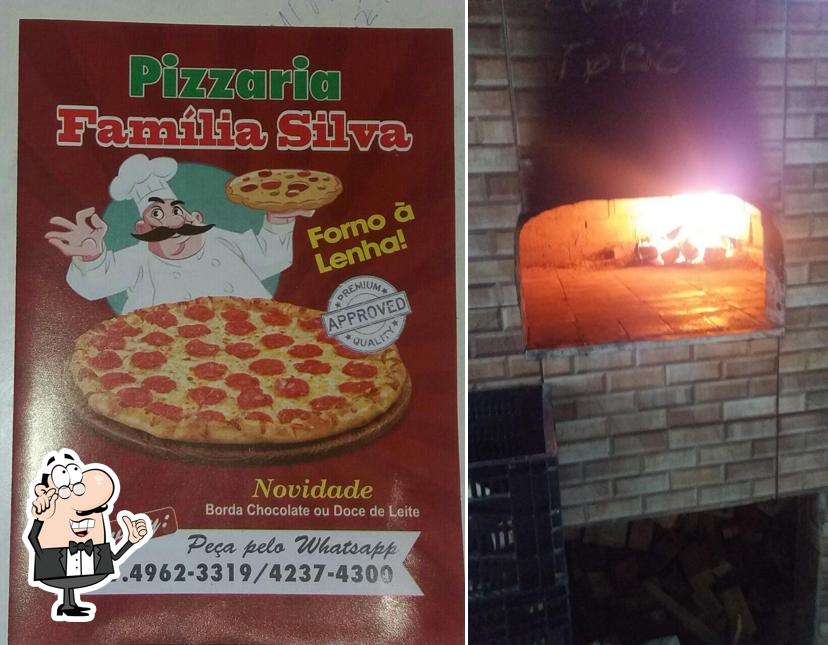 O interior do Pizzaria Família Silva