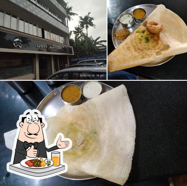 Check out the image depicting food and exterior at Udupi Woodlands Hotel & Tourist Home