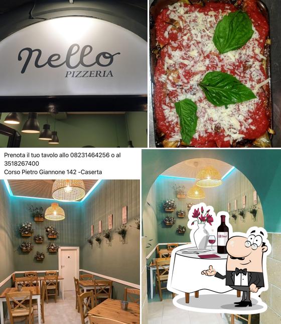 Nello Pizzeria si caratterizza per la tavolo da pranzo e interni