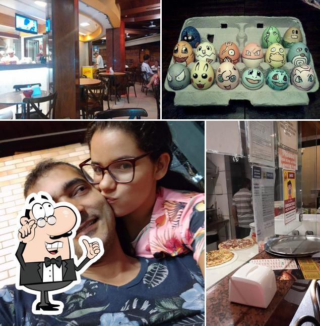 Sente em uma das mesas no Giro Burgueria e Pizzaria