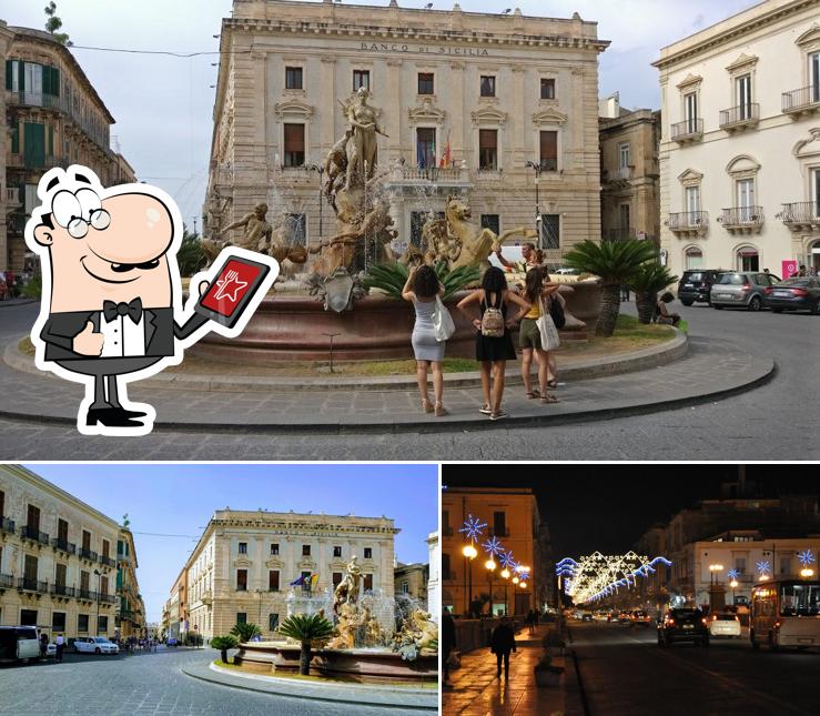 Guarda gli esterni di Piazza Archimede Caffè
