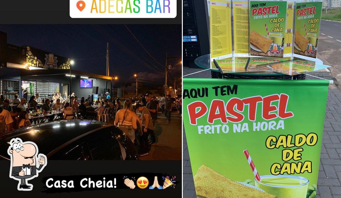 Look at the photo of Adega´s Bar