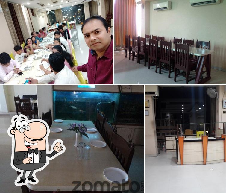 The picture of interior and dining table at Hotel Style Inn