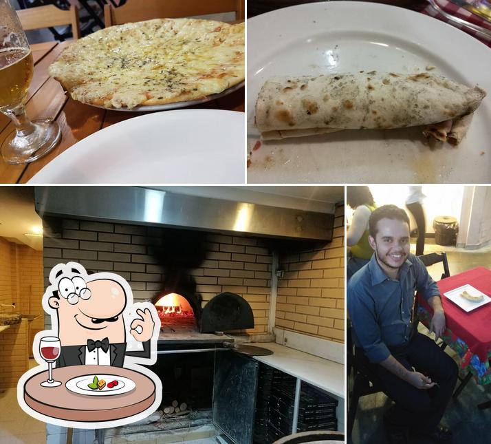 Esta é a imagem mostrando comida e interior a Pizza