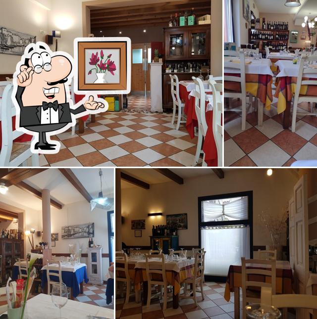 Siediti a un tavolo di Trattoria Pinos Di Scarabello Lucio