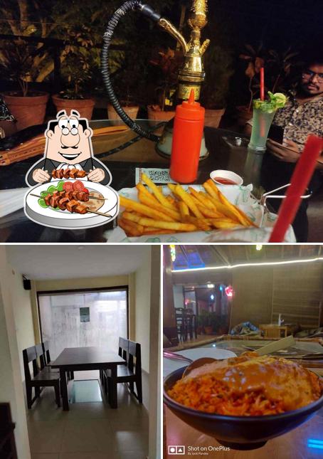 Take a look at the picture depicting food and interior at Cafe Hauz Khas