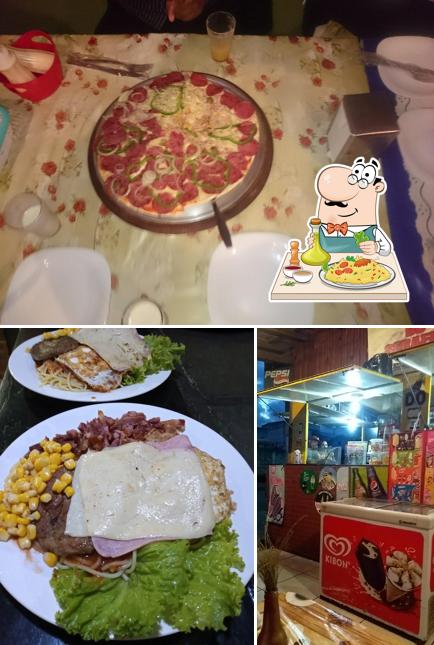 Entre diversos coisas, comida e mesa de jantar podem ser encontrados no Trailer Do Serafim
