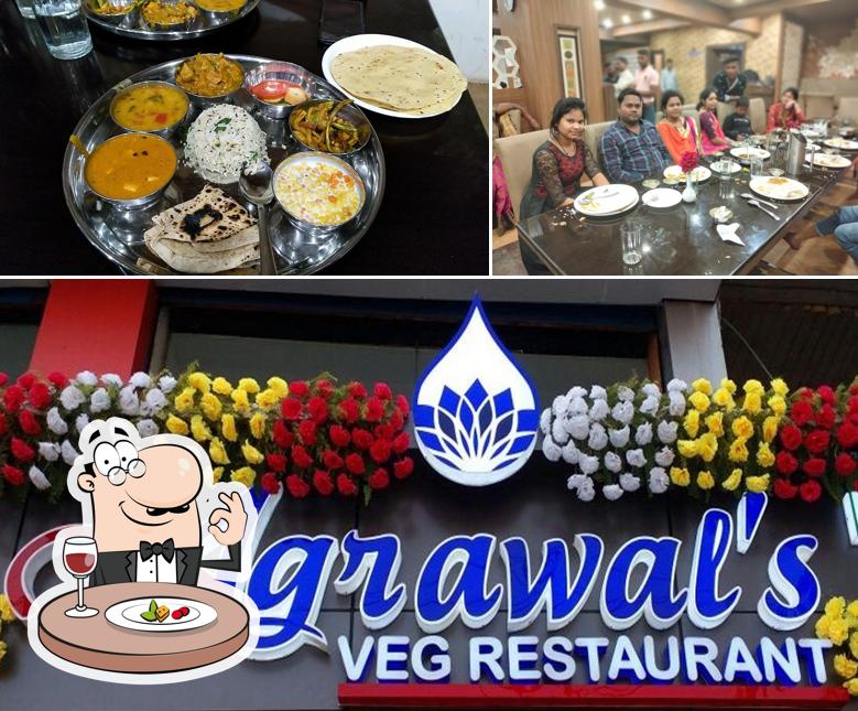 Check out the image showing food and dining table at Agrawal's Veg Restaurant