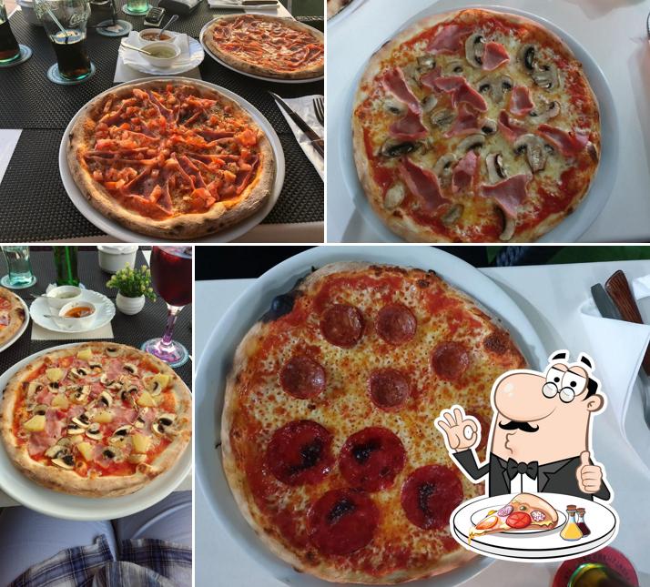 Get pizza at cala millor pizzeria bella napoli