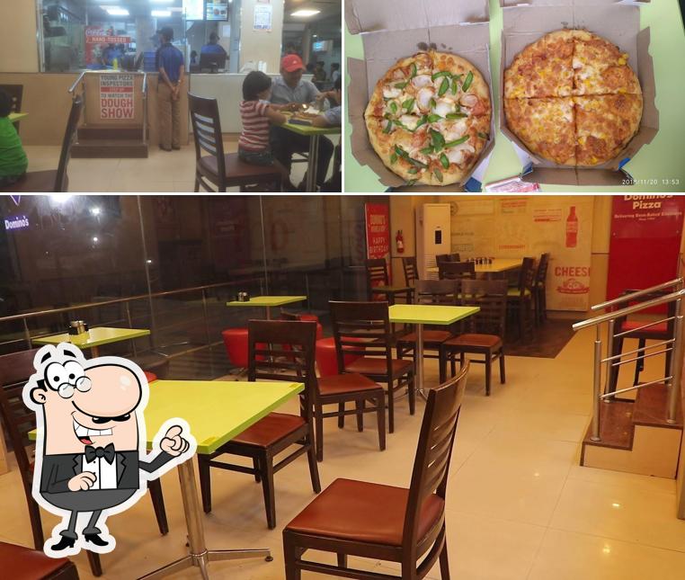 The photo of Domino's Pizza The IP MUGHAL MALL , Mughalsarai’s interior and pizza