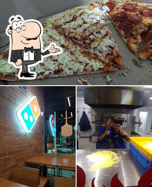 Esta é a imagem apresentando interior e pizza a Domino's Pizza - Bragança Paulista