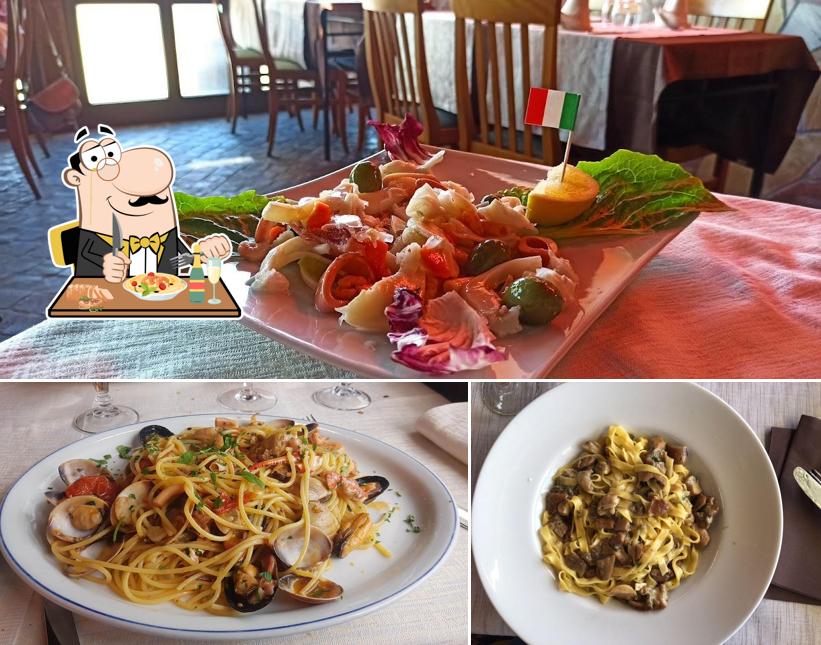Platti al Il Grottino - piatti tipici, specialità di pesce vista lago